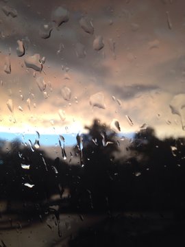 Summer Storm With Rain Drops At Window