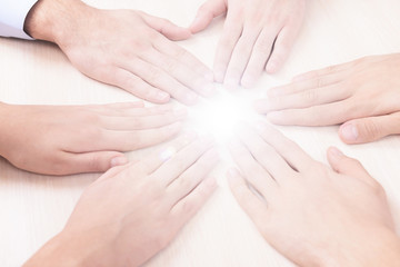 Many hands with light
