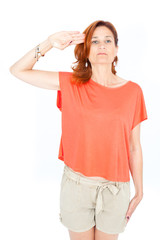 Fototapeta premium Beautiful businesswoman doing different expressions in different sets of clothes: at attention