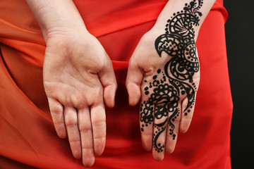 Image of henna on female hand, closeup