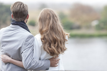 Back view of a couple arm in arm