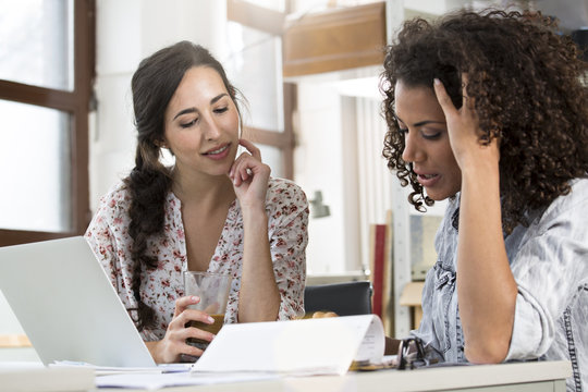 Two young fashion designers developing new ideas