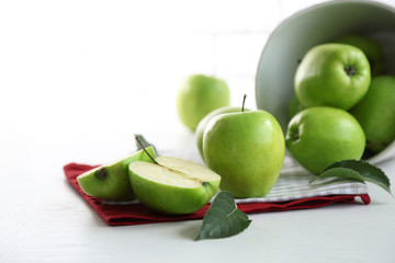 Green apples on table with napkins, closeup