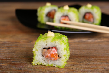 Rolls with sticks on wooden table close up