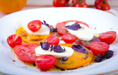 Caprese salad with tomatoes, mozzarella and basil.