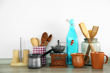 Composition with different utensils on wooden wooden table in kitchen