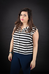 Fototapeta premium Beautiful woman doing different expressions in different sets of clothes: posing