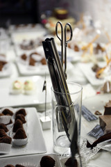 Blades for sweets in glass on table close up