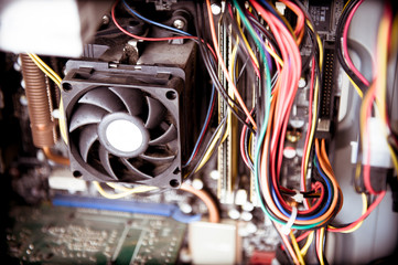 Old dusty pc cpu fan on motherboard