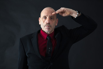 Fototapeta premium Handsome man doing different expressions in different sets of clothes: at attention