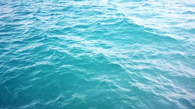 Blue Sea clear water wavy surface nature background abstract with copyspace.