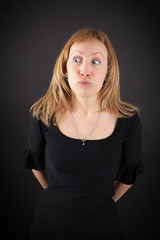 Fototapeta premium beautiful woman doing different expressions in different sets of clothes: worried