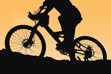 Obraz premium Mountain Biking up a trail in the mountains