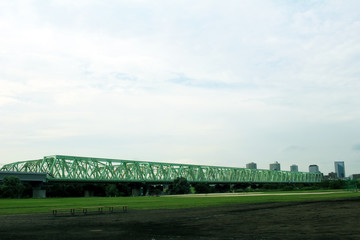 Riverbed and the railway bridge and the sky