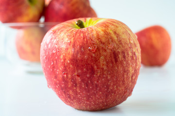 Red apples against white background.