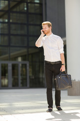 Young businessman with mobile phone