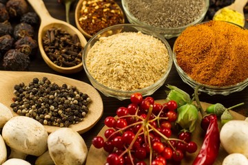  Wooden table with colorful spices, herbs and vegetables.  Wooden table with colorful spices. Asian cuisine