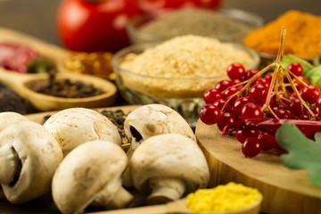  Wooden table with colorful spices, herbs and vegetables.  Wooden table with colorful spices. Asian cuisine