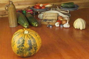 Growing vegetables in the organic farm. Vegetables grown in a small home garden. Old metal weight...