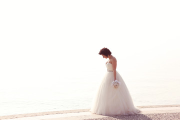 Fototapeta na wymiar Bride at seashore