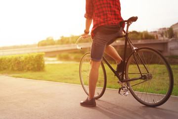 Man on bike ready to go. Sunflare