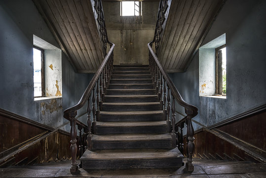 Wooden staircase in an abandoned house