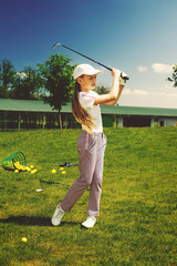 Girl playing golf