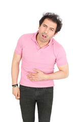 Fototapeta premium Handsome arabic man doing different expressions in different sets of clothes: stomachache