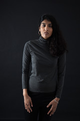 Beautiful woman doing different expressions in different sets of clothes: thinking