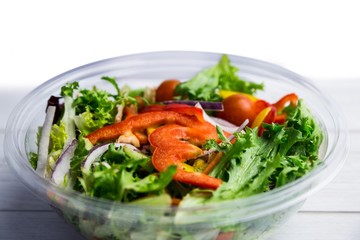 Healthy bowl of salad on table