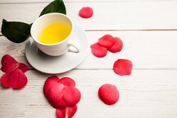 Cup of herbal tea on table