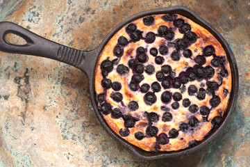 Cottage cheese casserole Cheesecake with blueberries in pan. top view