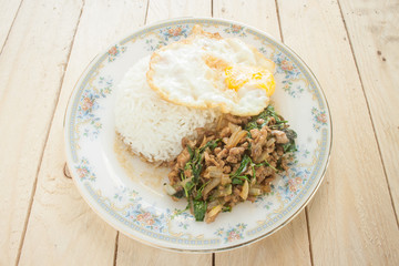 fried basil chicken fried egg thai food