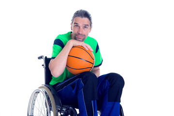 disabled man in a wheelchair is doing sport with ball