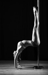 Fototapeta na wymiar Pole dancer, woman dancing on pylon