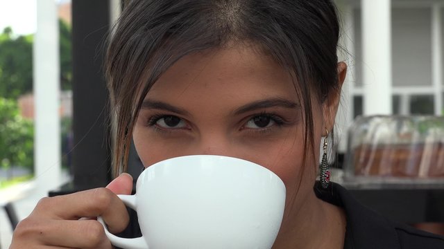 Woman Drinking Coffee or Tea