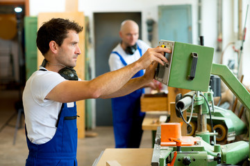 worker in factory using machine