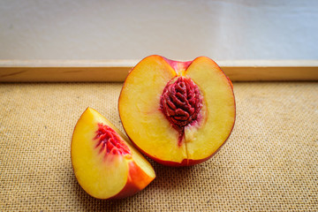 Half plum fruit on kitchen table