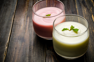 Obraz na płótnie Canvas Homemade yogurt in the glass on wooden background,healthy food