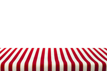 Table top covered with red and white stripped tablecloth