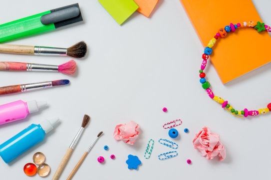 Photo of workplace with lots of stationery objects.