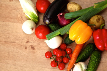 Pile of organic vegetables on a rustic wooden table