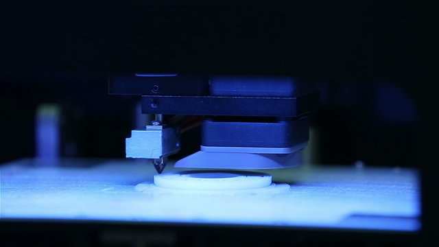Printing plastic model on a 3D printer in process.