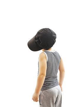 Back view of fashionable little boy.Hip-Hop Style  looking at wall.