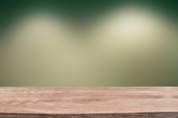 Wood table with blur concrete wall background - for montage or d