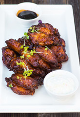Delicious chicken wings on the grill