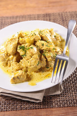 chicken cooked with curry sauce and herb