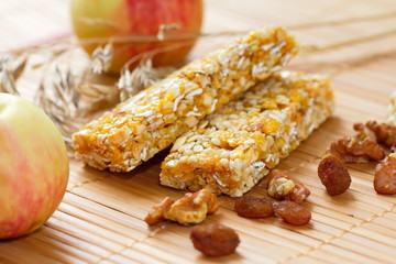 Cereal bars of granola with apples, nuts and raisins