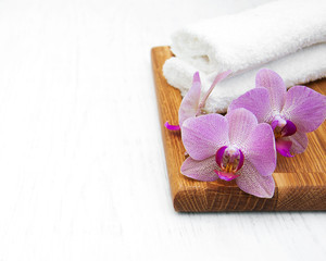 Pink orchids and towels