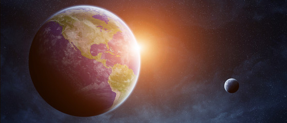 Fototapeta na wymiar Sunrise over planet Earth in space